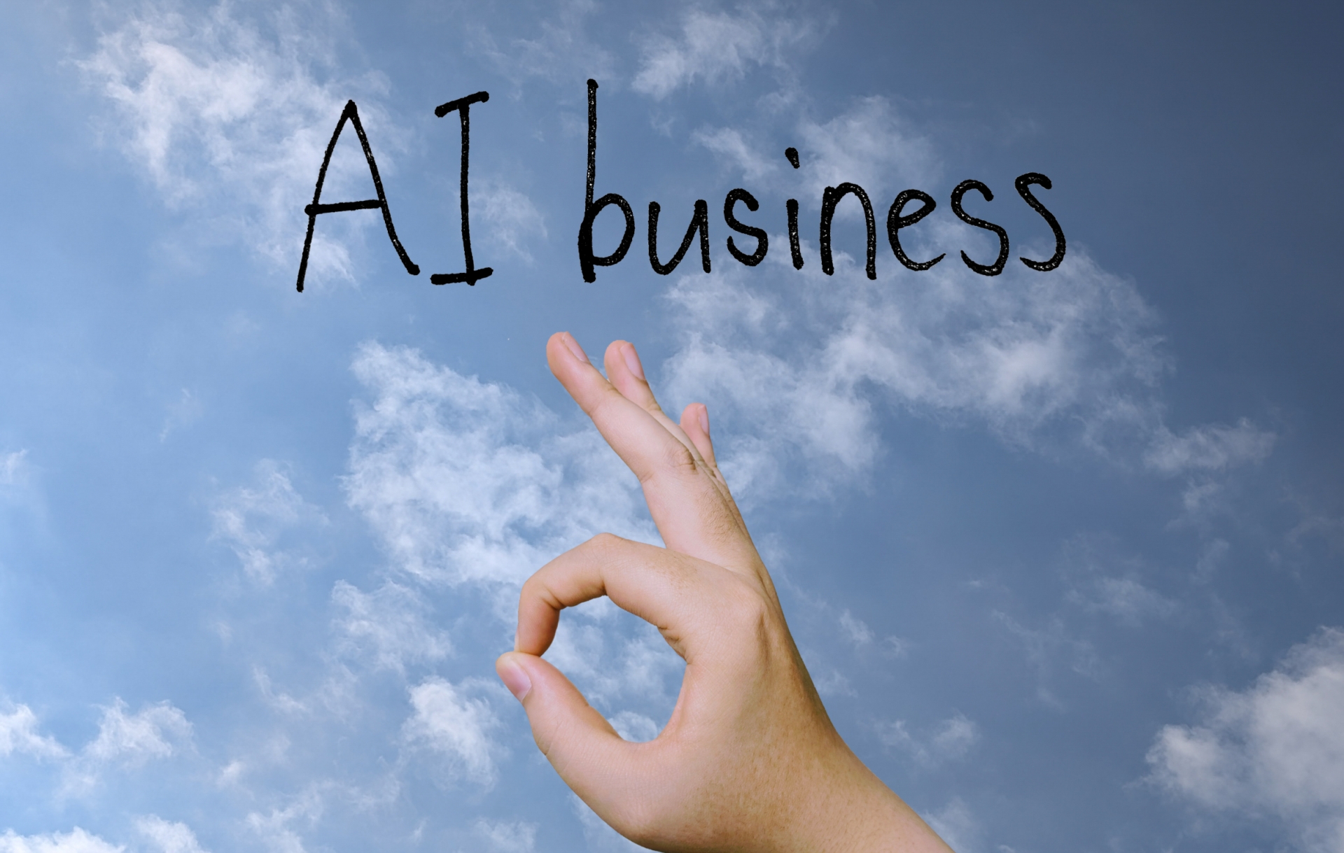 :AI businessの文字と指のOKサイン